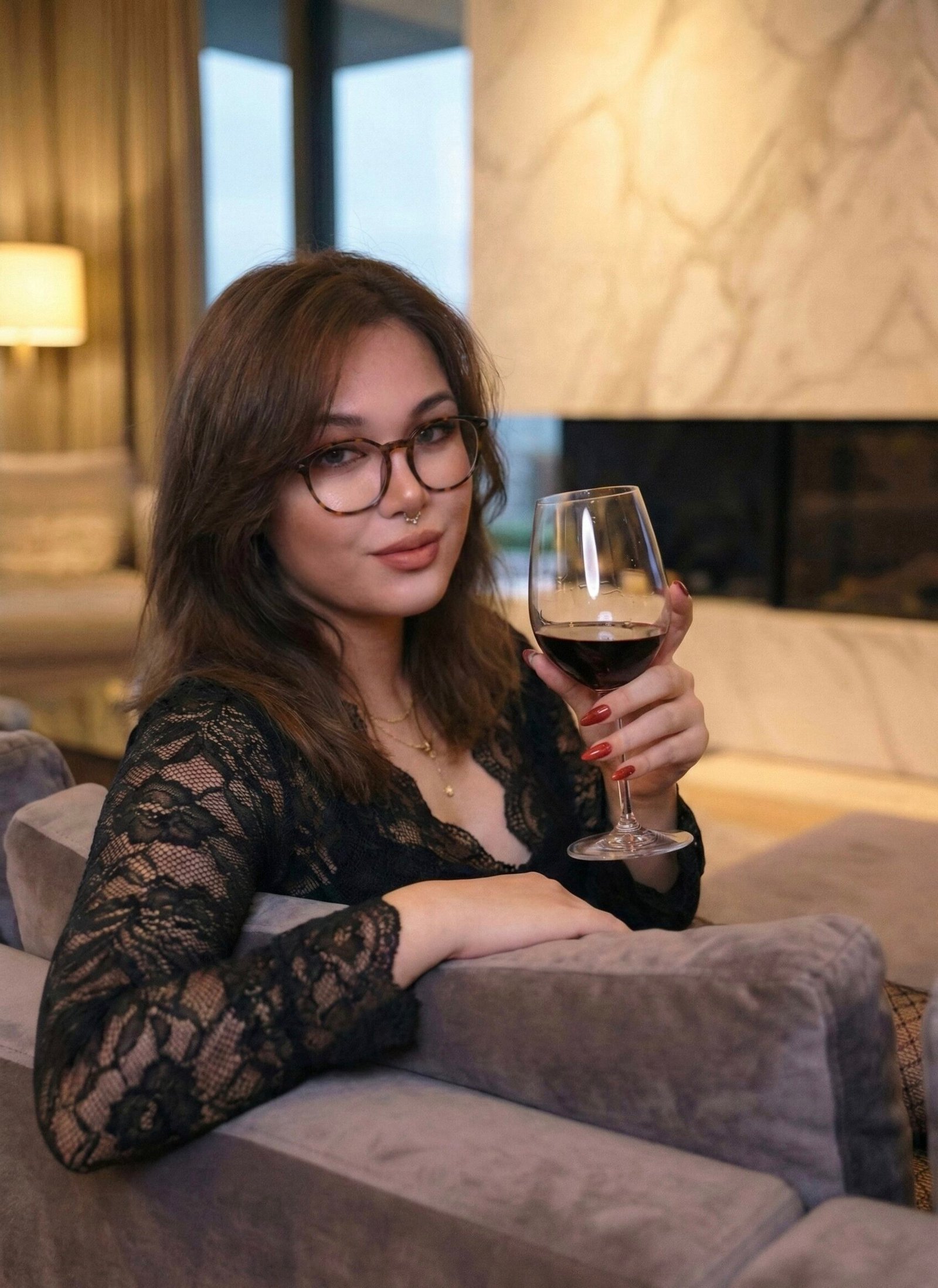 Goddess or Mistress or Princess Lacia Lucis in glasses wearing a black lace top while holding a glass of red wine