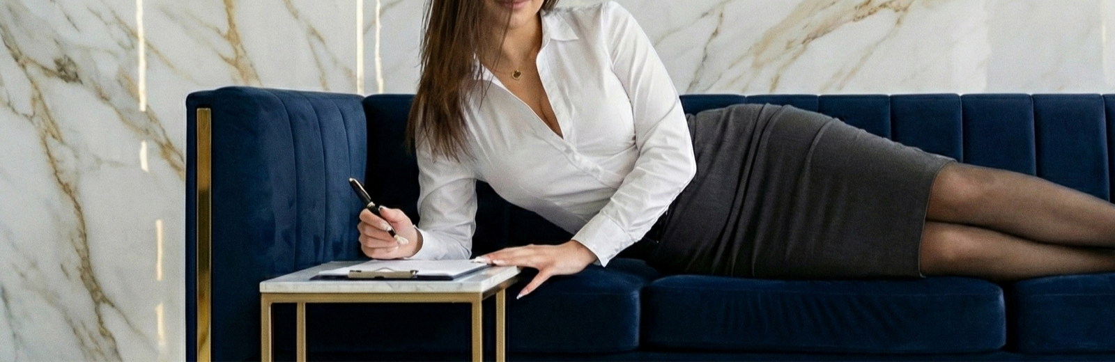 Findom Goddess and Mistress Lacia Lucis in business attire